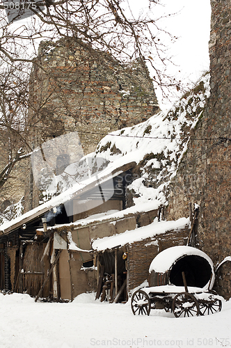 Image of old horse drawn carriage in the snow