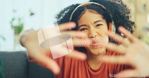 Image of Black woman, dancing and headphones on sofa, being content and singing words in living room. Young girl, headset and digital device for contemporary dancer, moving with rhythm and relax on break.