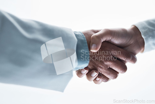 Image of Doctors, women and handshake on isolated white background for healthcare, wellness deal or teamwork collaboration. Zoom, medical and partnership gesture in hospital welcome, people trust or thank you