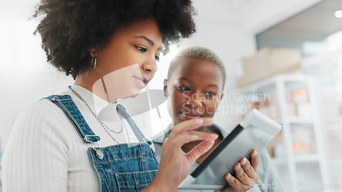 Image of Business women with digital tablet for a brainstorming, strategy and teamwork meeting in the office. Happy, diversity and corporate marketing professional using technology while talking and planning