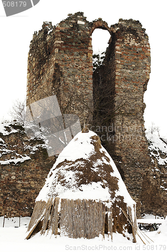 Image of old farm haystack with ruined castle