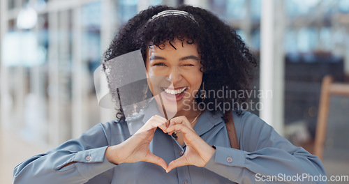 Image of Business woman, face or heart sign in modern office, marketing customer support or client branding care. Portrait, happy smile or love hands gesture for creative designer, Brazil worker and employee