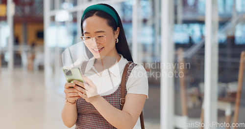 Image of Phone, mall and Asian woman typing, social media or messaging. Technology, coffee and happy female with mobile smartphone for networking, internet browsing or web scrolling alone at shopping mall.