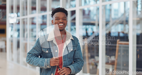 Image of Black man, face and smile portrait in building for designer success, positive mindset and employee standing in lobby. African man, portrait and happy for innovation vision or entrepreneur headshot