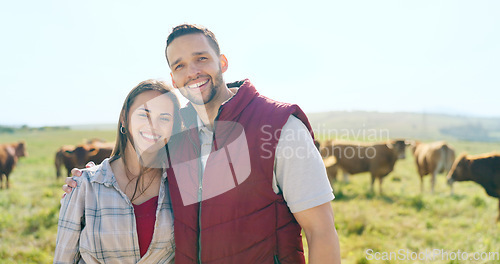 Image of Cow, love and happy couple on a cattle farm hugging, bonding and enjoy quality time outdoors in nature. Smile, portrait and woman farming cows and harvesting animal livestock with a farmer on field