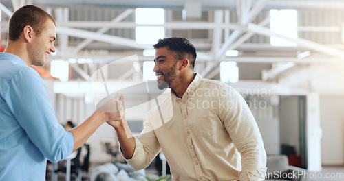 Image of Handshake, greeting and business men at work with a welcome, thank you or communication. Happy, casual and corporate employees with hand gesture for a hello, agreement and coworking in an office