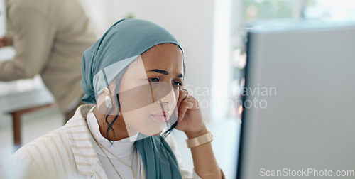 Image of Hijab, headache and business woman burnout at a office computer feeling anxiety and stress. Finance employee, islam and muslim female at work doing tax audit at a computer worried about mistake