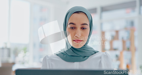 Image of Islamic woman, laptop and focus working in office with hijab for religion, reading online communication or arabic company manager. Muslim, entrepreneur and planning on digital tech with head scarf