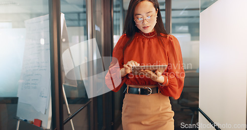 Image of Business, technology and Asian woman in office, working with team on laptop, tablet and computer in workplace. Success, teamwork and female worker walking, meeting and planning for digital marketing