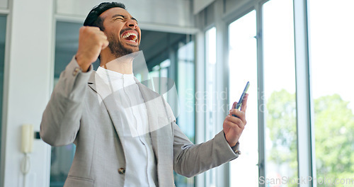 Image of Success, phone and winner with businessman in office and celebration for deal, growth and stock market target. Wow, goals and good news with fist of employee for achievement, future and sale