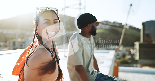 Image of Wind, fashion and woman on city rooftop for summer break, Portugal holiday or vacation location with style, trendy or cool clothes. Portrait, smile or happy student or tourist bonding with black man