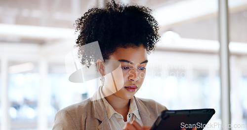 Image of Business woman, tablet and face with focus and leadership, technology and corporate communication. Email, networking and digital marketing with seo, black woman executive typing with research online