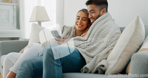 Image of Happy, couple with phone for communication, networking or social media app at home. Movie, video or love man and woman relax in living room streaming online, internet or website with smile in house