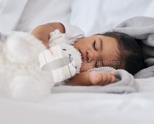 Image of Sleeping, teddy bear and cute with baby in bedroom for relax, comfortable and dreaming. Innocence, young and rest with tired child at home for and napping with toy for bedtime, youth and sweet