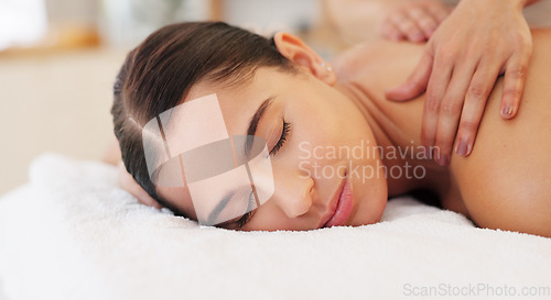 Image of Health, relax and woman getting back massage at luxury spa lying on table with smile and massage therapist hands on back. Wellness, body care and physiotherapy service at beauty salon for happy women