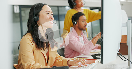 Image of Call center, consulting or Asian business woman with computer for telemarketing, customer service or contact us. Communication, sales or crm girl employee at help desk agency for technical support