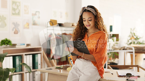 Image of Black woman, tablet and small business in ecommerce, fashion or logistics in remote startup at home. African American female owner working on touchscreen technology in clothing store success