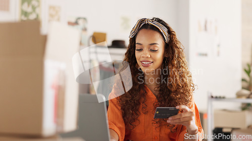 Image of Credit card, shopping and black woman on the internet with a laptop in an office at work. Happy business owner making an online payment for stock for her small business with a card and computer