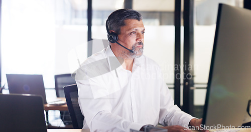Image of Call center, man and customer service for consulting, telemarketing and help online in office. Male agent, consultant and headset for client service, employee and conversation for speaking and advice