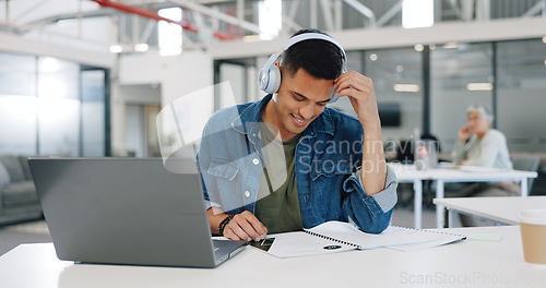 Image of Music, laptop and a business man reading paperwork while working in his office on a project or report. Research, learning and documents with a male employee streaming or listening to audio at work