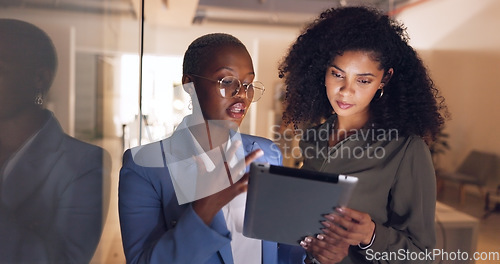 Image of Black women, business and tablet in discussion or meeting for corporate strategy, planning or collaboration at office. African woman executive talking to employee on touchscreen technology at work
