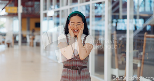 Image of Wow, surprise and excited with a business asian woman looking shocked by putting her hands on her face in expression. Portrait, emoji or motivation with a female employee feeling shock frim good news