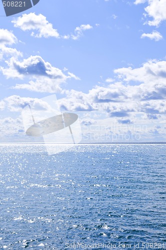 Image of Blue water and sunny sky background