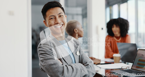 Image of Laptop, meeting and face of a professional Asian man in the office conference room planning a corporate strategy. Happy, smile and portrait of businessman working on a project with team in workplace