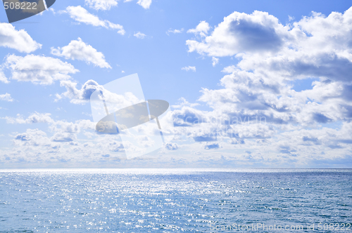 Image of Blue water and sunny sky background