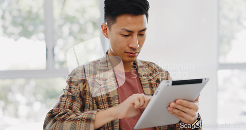 Image of Digital tablet, research and Asian man in the office planning a creative design for marketing. Creativity, technology and male employee working on advertising project with mobile device in workplace.