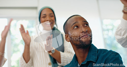 Image of Success, applause and feedback, man in office at creative startup business with proud team. Congratulations, cheering and support for winner target achievement with employees clapping hands at desk.