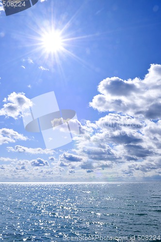 Image of Blue water and sunny sky background