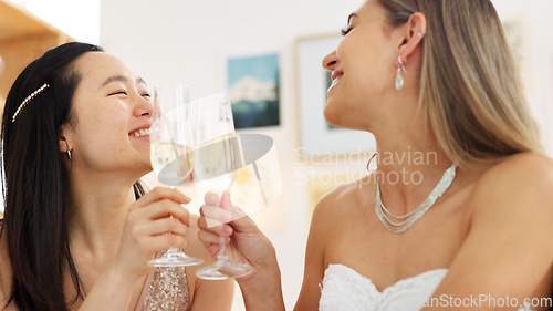 Image of Wedding, bride and toast with a woman and her bridesmaid drinking champagne before a marriage ceremony or celebration event. Glass, cheers and celebrating with a young female laughing with a friend