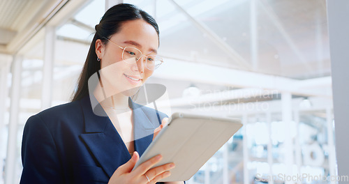 Image of Business woman, tablet and technology, typing email for company communication or digital report. Internet, wifi and ux, networking and Asian employee with smile and inspiration in Japan office