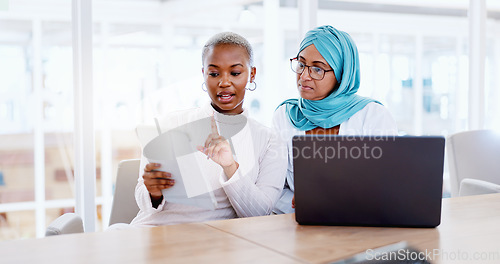 Image of Business, women and explain with laptop, documents or update planning schedule, modern office or advertising agency. Coworkers, black female or Muslim lady speaking, brainstorming or confirm deadline