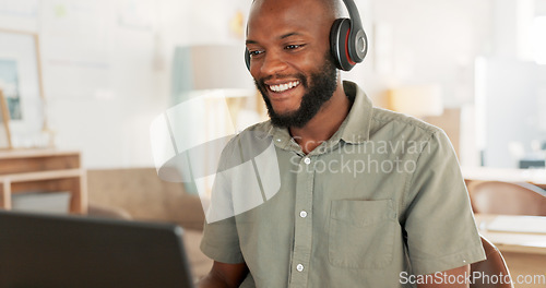 Image of Laptop, headphones and black man on an online video call or meeting for his remote corporate job. Happy, talking and African guy on a webinar, video conference or seminar call with a computer at home