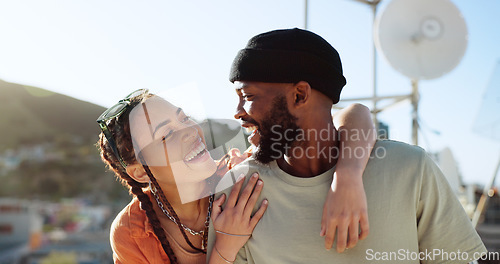 Image of Interracial couple, hug and bonding on city building rooftop for summer holiday, travel vacation date and location break in Boston. Smile, happy black man and talking woman or student fashion friends