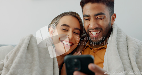 Image of Happy, couple with phone for communication, networking or social media app at home. Movie, video or love man and woman relax in living room streaming online, internet or website with smile in house