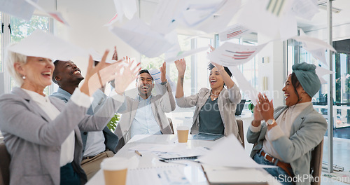 Image of Business people, throwing paper or success meeting in winner finance planning, company growth goals or target motivation. Happy smile, flying documents or excited financial teamwork in diversity kpi