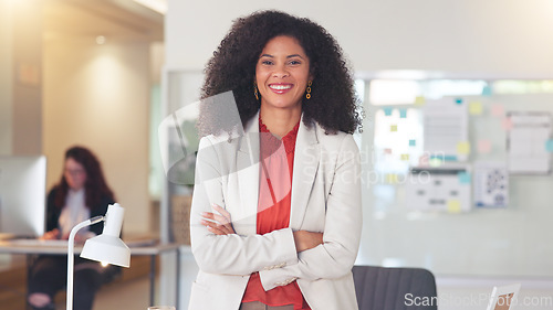 Image of Confident human resources manager looking motivated and ambitious for success. Portrait of a black business woman standing arms crossed, smiling and feeling positive while working in an office