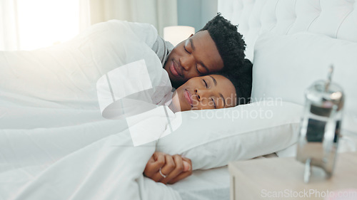 Image of Comfort couple, sleeping in bedroom and morning cuddle for rest, relax and rest break at home. Happy, love and cozy people in romantic relationship with care, hug and smile together in bedroom