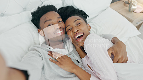 Image of Selfie and happy influencer couple vlogging their honeymoon while lying in bed to love and relax together at home. Portrait of a loving black man and woman having romantic moment in the morning