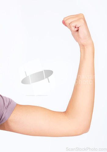 Image of Woman, arm or flexing muscle on studio background for female empowerment, human rights or gender equality. Zoom, model or strong bicep in power, motivation or freedom strength fist on mockup backdrop