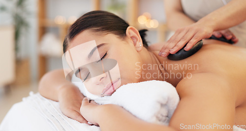 Image of Spa wellness, massage and woman relax healthy skincare wellness treatment. Young calm sleeping girl, zen therapy masseuse hands and serenity stress relief on back or body luxury hot stone detox