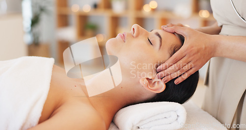Image of Wellness, spa and woman getting facial massage in beauty salon to relax. Calm, peace and luxury treatment for skin, massage therapy for stress relief, skincare and beautician massaging face of client