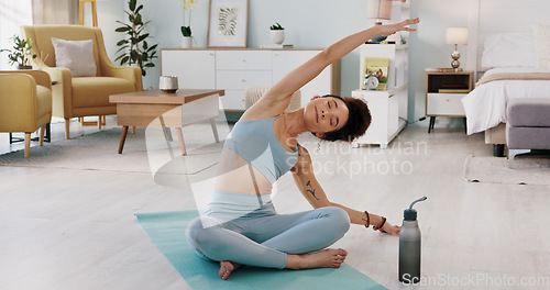 Image of Fitness, yoga or meditation stretching woman for workout in the living room of her house. Girl with chakra focus, mindset or balance while training, exercise or health with zen pilates for wellness.