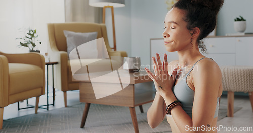 Image of Meditation, pilates and home yoga for black woman working on spiritual chakra peace, freedom of the mind and zen mindset. Body health, wellness lifestyle and relax girl training on living room floor