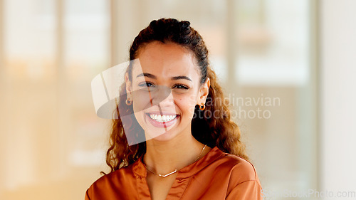 Image of Latino business woman smiling and laughing with joy in an office. Portrait of a confident and ambitious young entrepreneur feeling motivated, empowered and optimistic for success in a startup company