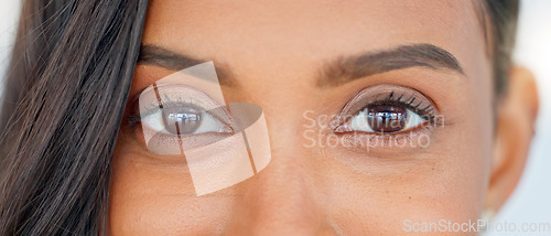 Image of Confident, happy and beautiful woman face, looking excited and free, proud female cheerful about beauty procedure. Closeup portrait of female smiling after getting natural looking eyelash extensions