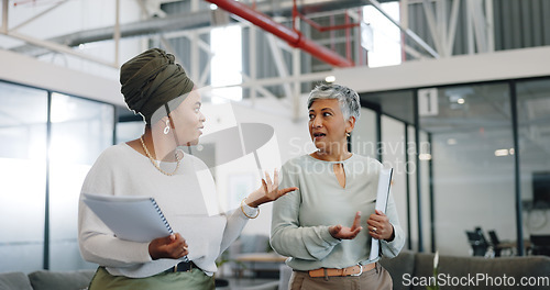 Image of Business women, conversation and modern office for marketing strategy, planning and busy. Female employees, manager and worker in workplace, advertising campaign and startup company schedule and talk